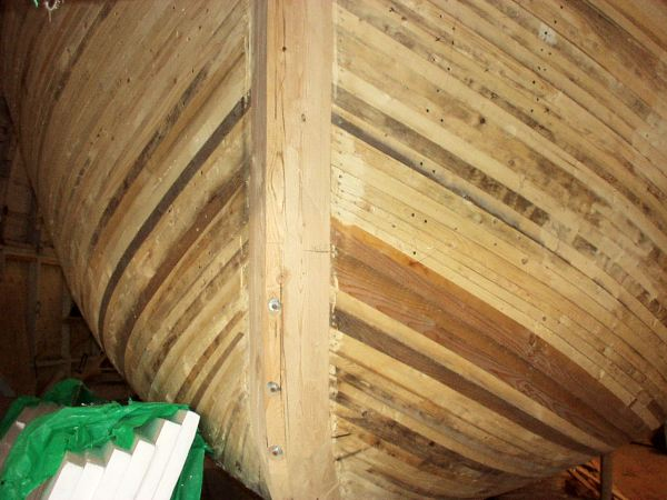 661: Bernard Mulrooney's new 38' long boat under construction in the boathouse by the lift bridge  in Placentia. (2004)